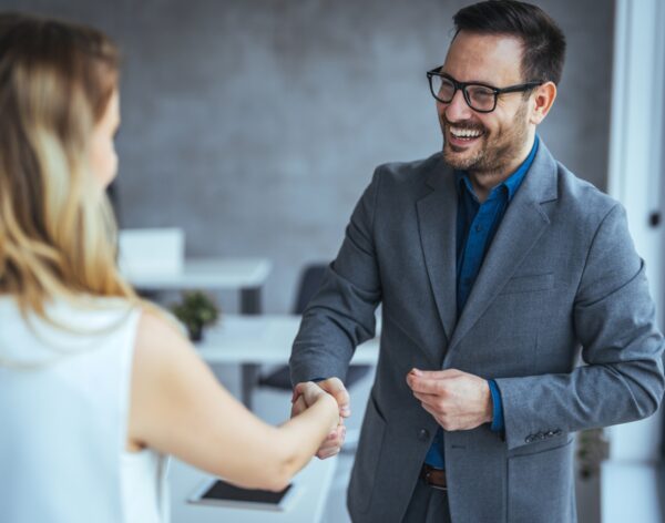 Business,People,Shaking,Hands,After,Successful,Meeting.,Businessman,And,Businesswoman